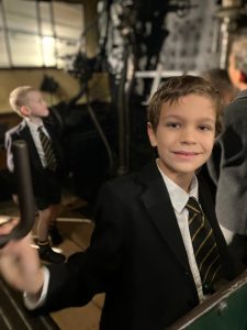 Smiling student in school uniform at Inchmarlo, promoting top educational experiences.