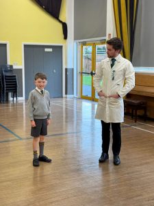 Child and doctor engaging in health checkup at Inchmarlo care facility.