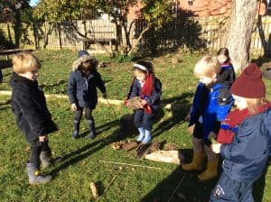 Children playing outdoors at Inchmarlo, enjoying nature and community activities in a scenic setting.