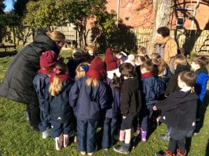 Children gathered outdoors in Inchmarlo, enjoying a sunny day in the grounds.