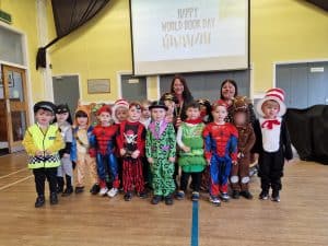 Happy children in festive costumes at Inchmarlo nursery event.