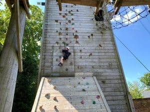 Children's outdoor rock climbing wall at Inchmarlo in Scotland, suitable for family adventure and fun.
