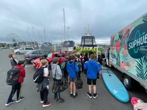 Students arriving at Inchmarlo for outdoor activities in scenic surroundings.