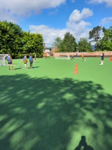 Students playing sport at Inchmarlo outdoor field.