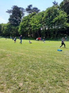 Scenic Inchmarlo golf course with players enjoying a sunny day outdoors.