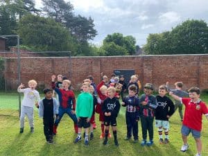 Children playing outside at Inchmarlo School in scenic outdoor setting.