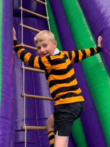 Child climbing inflatable obstacle course for kids at Inchmarlo.