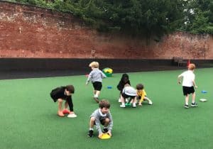 Children playing on a colorful outdoor playground at Inchmarlo, a family-friendly location.