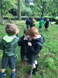 Children exploring nature at Inchmarlo in lush green parkland.