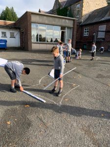 Children playing outside at Inchmarlo, enjoying outdoor activities and fresh air.