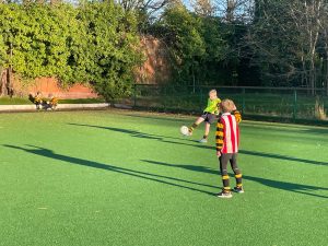 Children playing football at Inchmarlo outdoor sports ground.