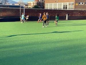 Kids playing football at Inchmarlo sports ground in Scotland.