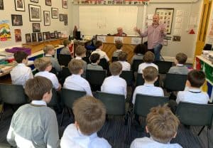 Children in school classroom learning environment.