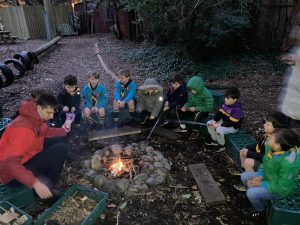Children enjoying a campfire at Inchmarlo outdoor activity.
