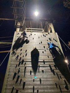 Outdoor rock climbing wall at Inchmarlo estate with two climbers enjoying an adventurous day.