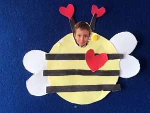 Child's face in bee costume for children’s activity at Inchmarlo. Fun, creative indoor kids' entertainment.