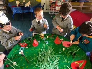 Children engaged in holiday crafts at Inchmarlo, a family-friendly destination with festive activities for kids and parents.