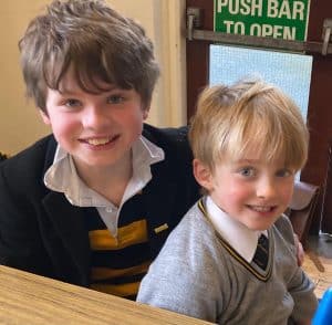 Smiling children at Inchmarlo school in Scotland, showcasing excellent learning environment.