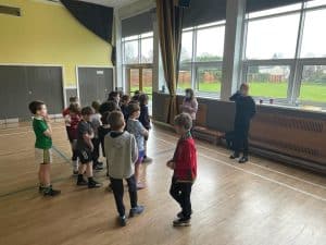 Children learning in a spacious indoor classroom.