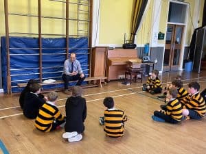 Children participating in a classroom activity at Inchmarlo School, engaging students in learning within a supportive environment.