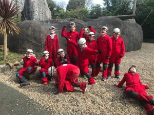 Children playing soccer outdoors at Inchmarlo estate in Scotland.