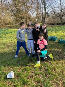 Group of children playing outdoors at Inchmarlo, enjoying nature and recreational activities.