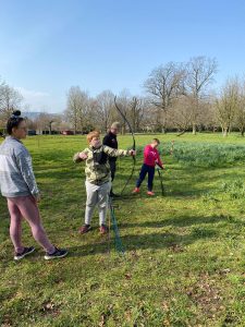 People enjoying outdoor activities at Inchmarlo’s expansive gardens.