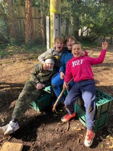 Children playing outdoors at Inchmarlo Garden, enjoying nature and family fun.