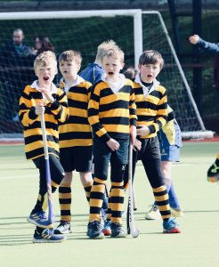 Children playing soccer at Inchmarlo sports field in Scotland.