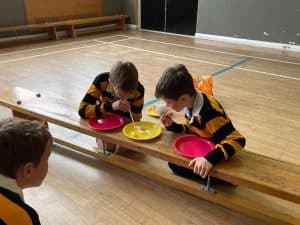 Children enjoying food activity at Inchmarlo school.