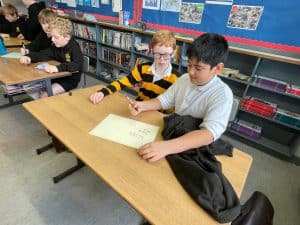 Young students reading in a school library at Inchmarlo.