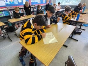 Students focused on classroom reading activities at Inchmarlo School.