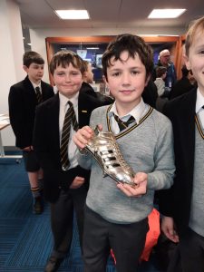 Group of happy students in school uniforms at Inchmarlo School, showcasing student engagement and academic environment.