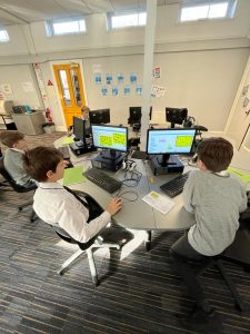 Students using computers at Inchmarlo day school in Scotland.