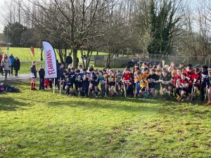 School children participating in an outdoor running event at Inchmarlo, Aberdeen campus.