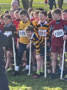Children participating in a school race at Inchmarlo, outdoor sports event.