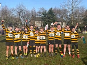 Happy children in sports uniforms at Inchmarlo sports event.