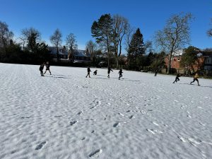 Children and families enjoy winter skiing at Inchmarlo with scenic snow-covered landscapes.