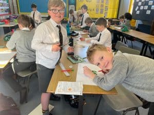 Children working on classroom activities at Inchmarlo School, a local educational institution in Scotland.