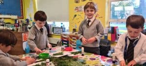 Children engaged in classroom activity at Inchmarlo School.