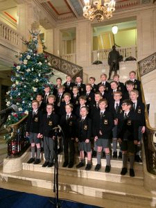 Elegant Christmas concert at Inchmarlo House with children and festive decorations.