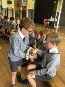 Young students in school uniform during an assembly at Inchmarlo School, emphasizing education and community values.