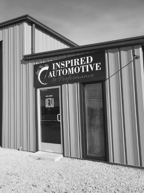Inspired Automotive service center exterior in black and white.