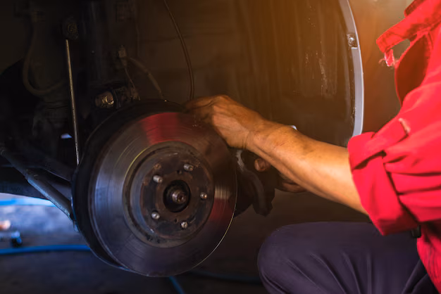 mechanic working on brake
