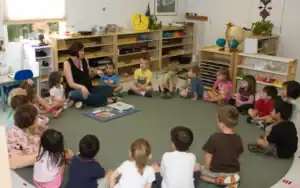 Children sitting in a circle during storytime at Jarrell Montessori classroom.
