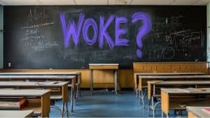 Empty classroom with a chalkboard displaying "WOKE?" in bright purple text and wooden desks.