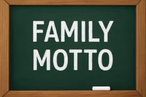 Famous Montessori family motto written on a green chalkboard with wooden frame.