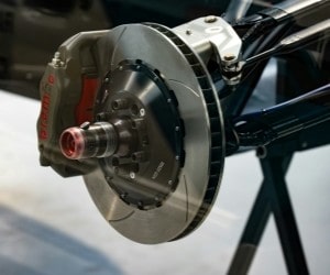 Close-up of a high-performance brake caliper and rotor on a vehicle.