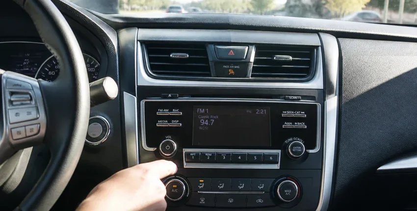 Auto Electric Service Dashboard with radio and climate controls.