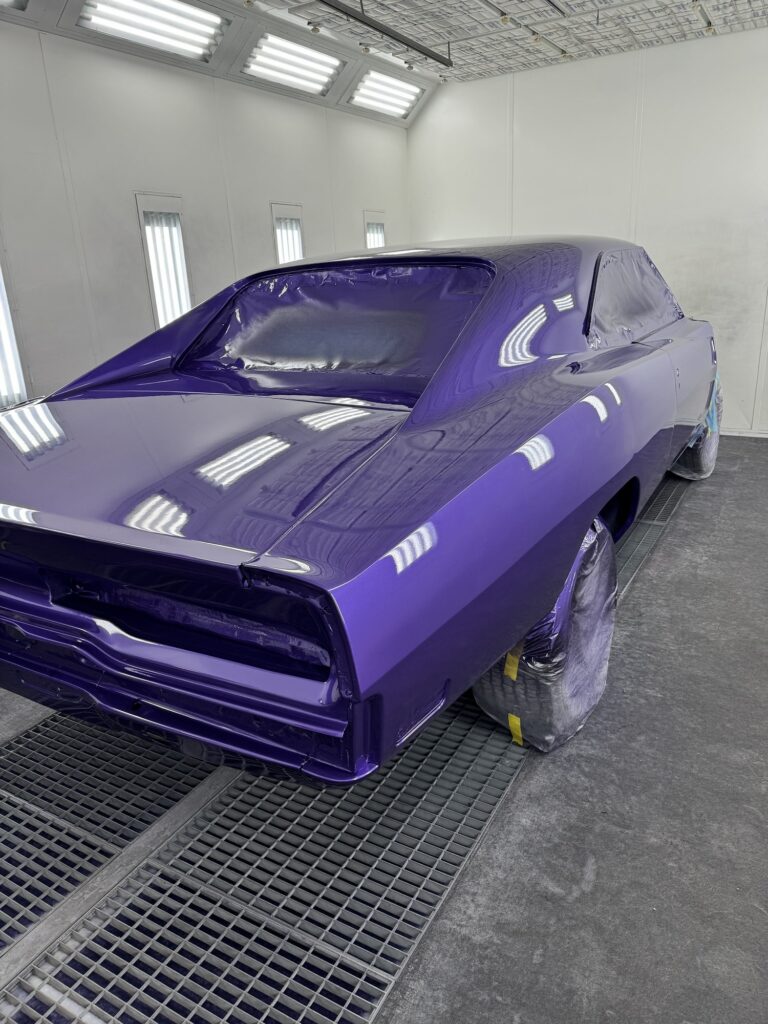High-quality purple classic car being painted at John's Auto Restorations.